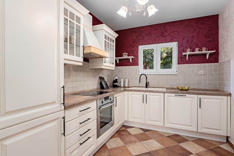 Prepare meals in a kitchen equipped with all necessary appliances.