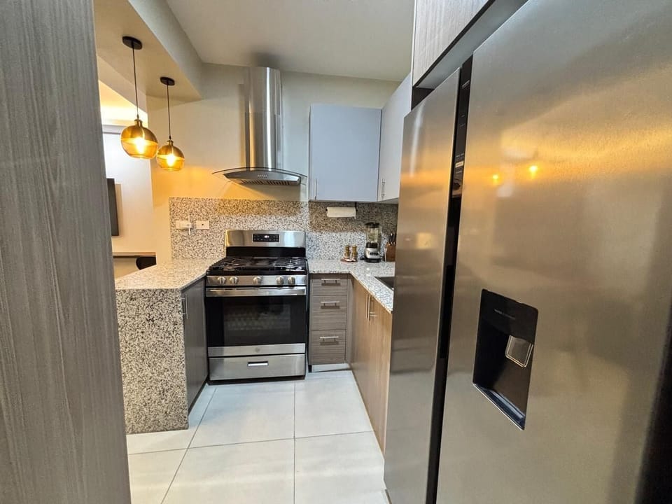 Luxury Apartment, Balcony, Pool View | Private kitchen | Fridge, microwave, oven, stovetop