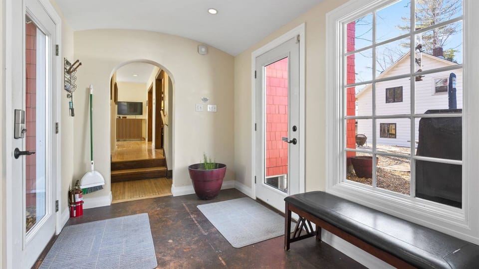Beautiful entry area connecting the main house and the main floor suite, offering a seamless flow between spaces and an inviting transition throughout the home.