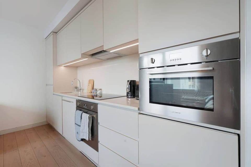 Kitchen equipped with all essentials, including, oven, fridge and full cookware set.