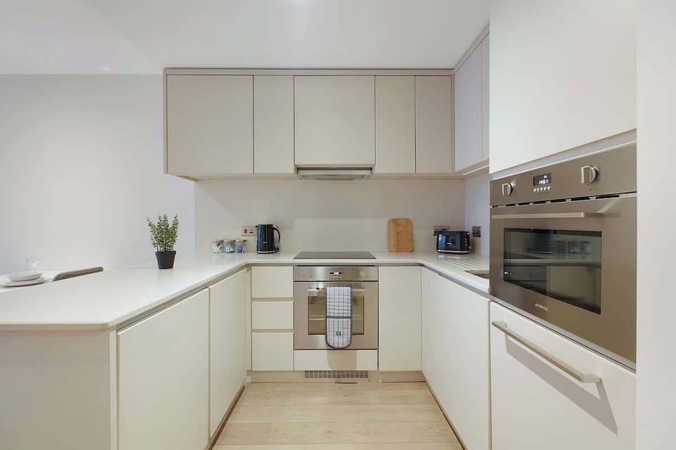 Kitchen equipped with all essentials, including, oven, fridge and full cookware set.