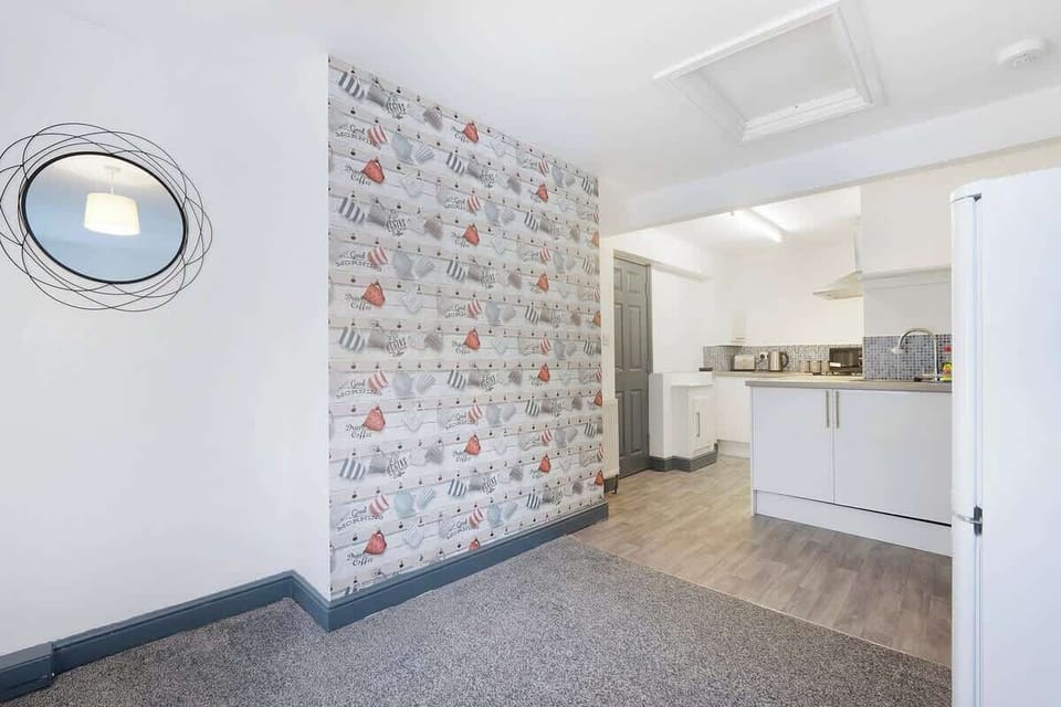 Kitchen equipped with all essentials, including a washer & dryer, oven, fridge and full cookware set.