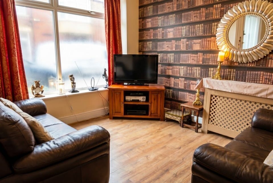 Cosy Shakespeare lounge with DVD and VHS for movie nights.