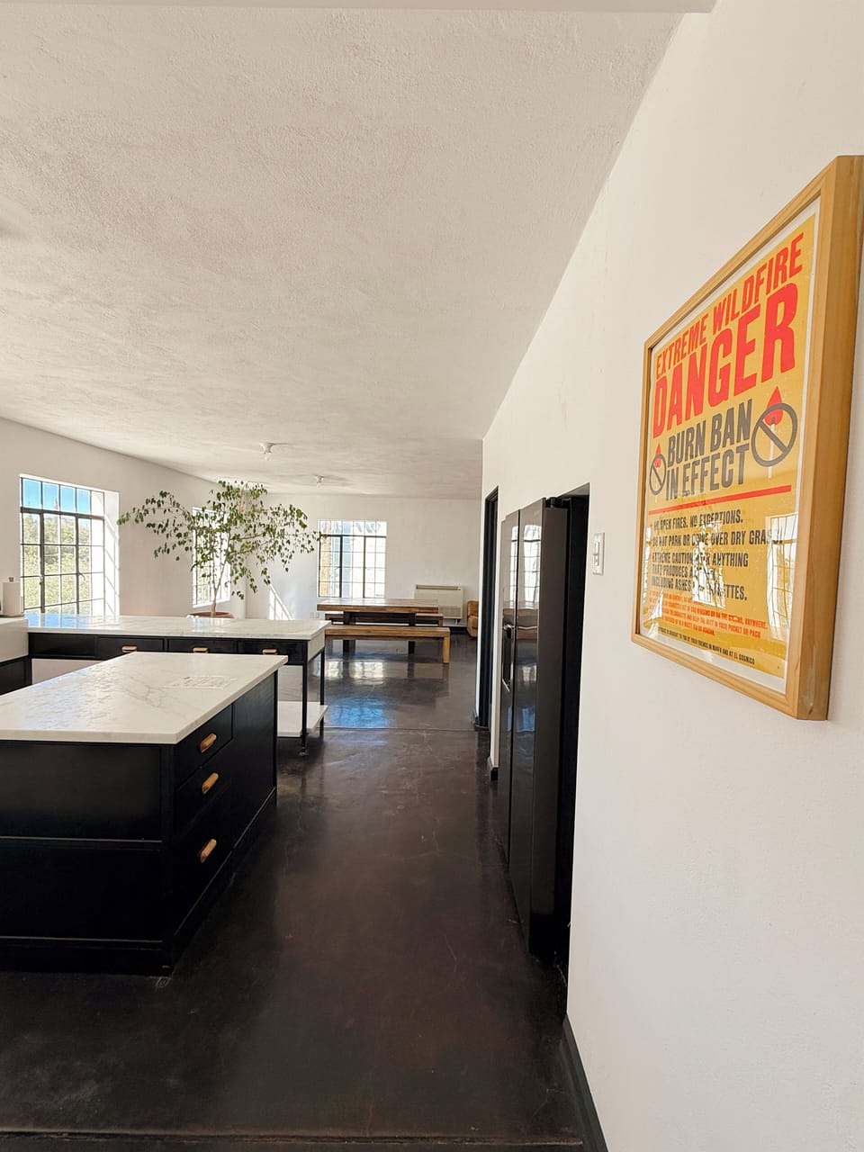 Full kitchen with fridge and ample counter space for preparing dishes.