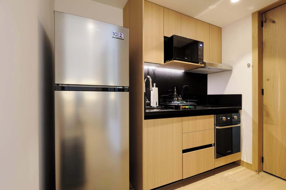 Fully equipped kitchen with modern appliances.

