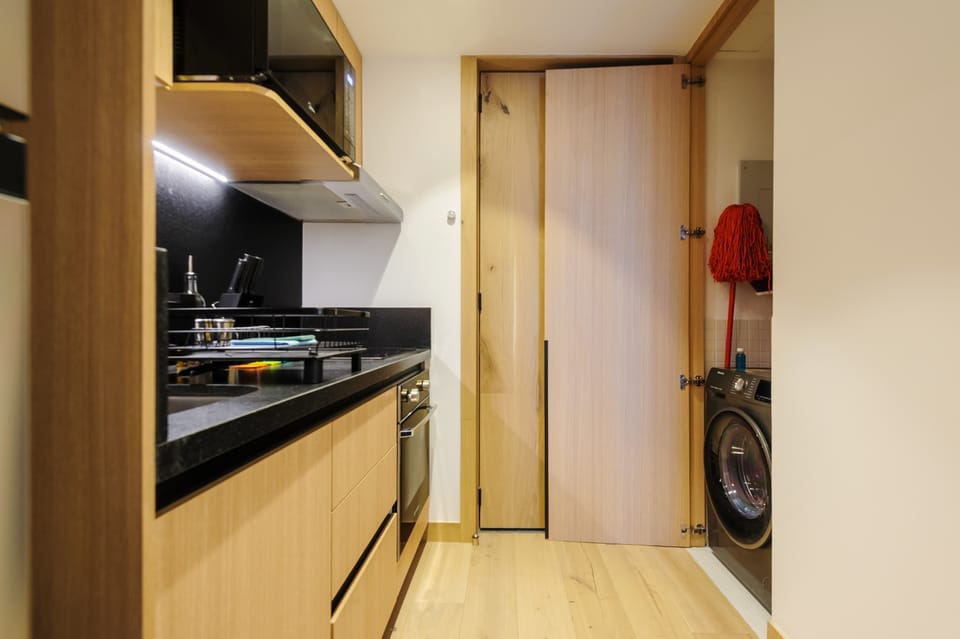 Sleek kitchen layout with contemporary finishes.
