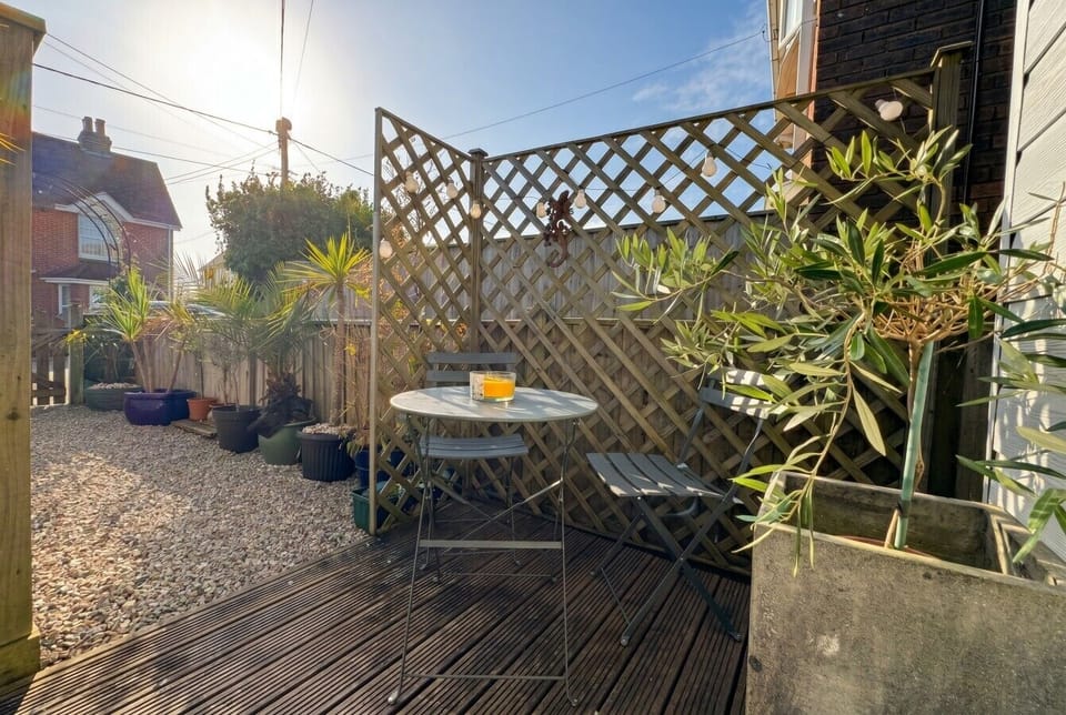 A second sunny terrace tucked behind trellis, ideal for morning coffee.