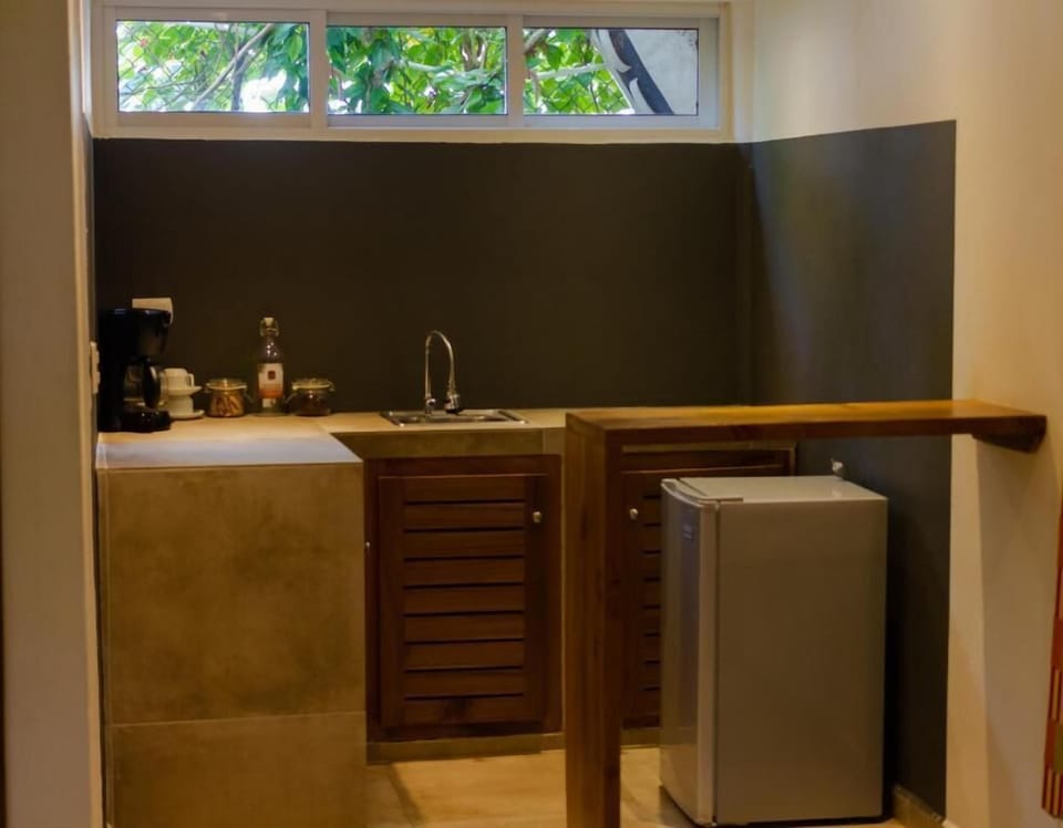 Deluxe Quadruple Room, Balcony | Private kitchen