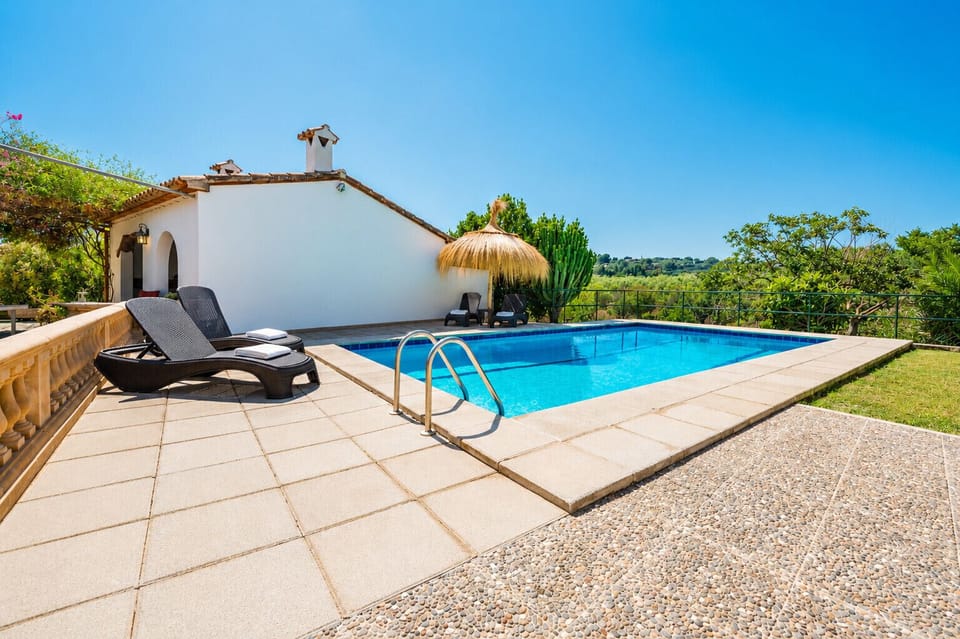 Villa Gorgs Petit in Pollensa with private pool, terraces and Mediterranean countryside views in Mallorca.