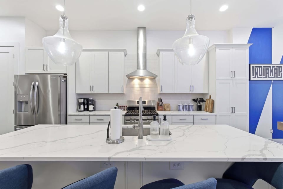 Cook up a feast in this sleek, fully-equipped kitchen with a gorgeous marble island.