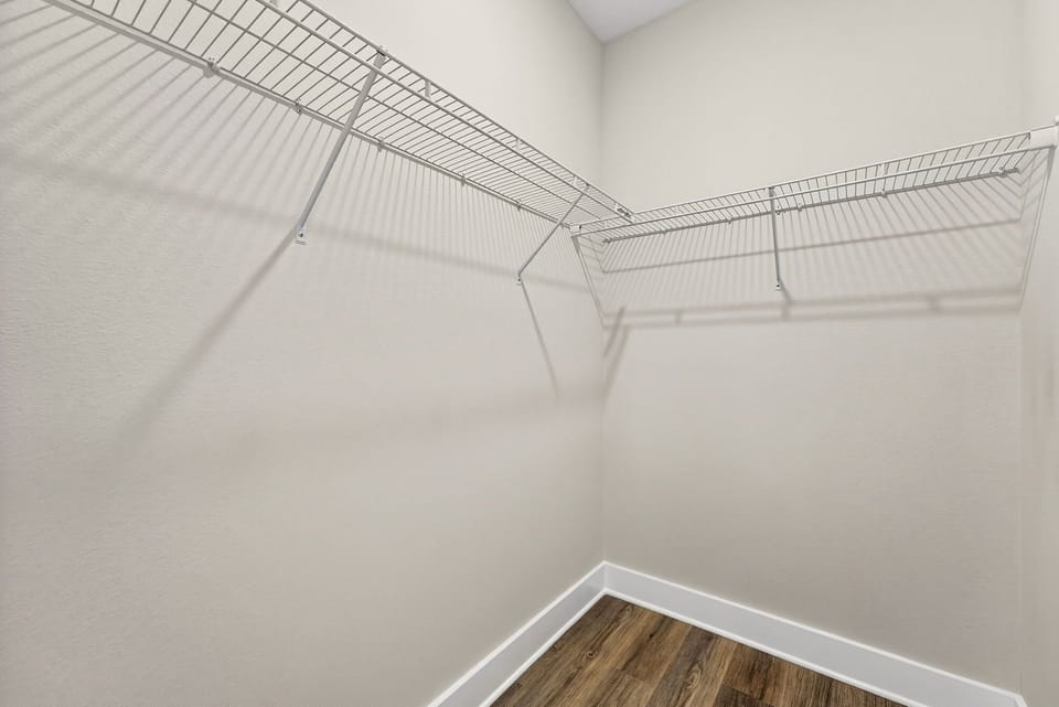 Your spacious walk-in closet offers generous shelving and plenty of room to organize everything you need for a comfortable stay.