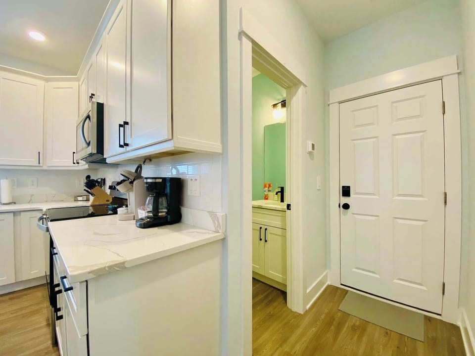 Fully Equipped Kitchen w/ Refrigerator, Oven, Stove, Microwave, Coffee Maker, Cooking Utensils, and Breakfast Bar