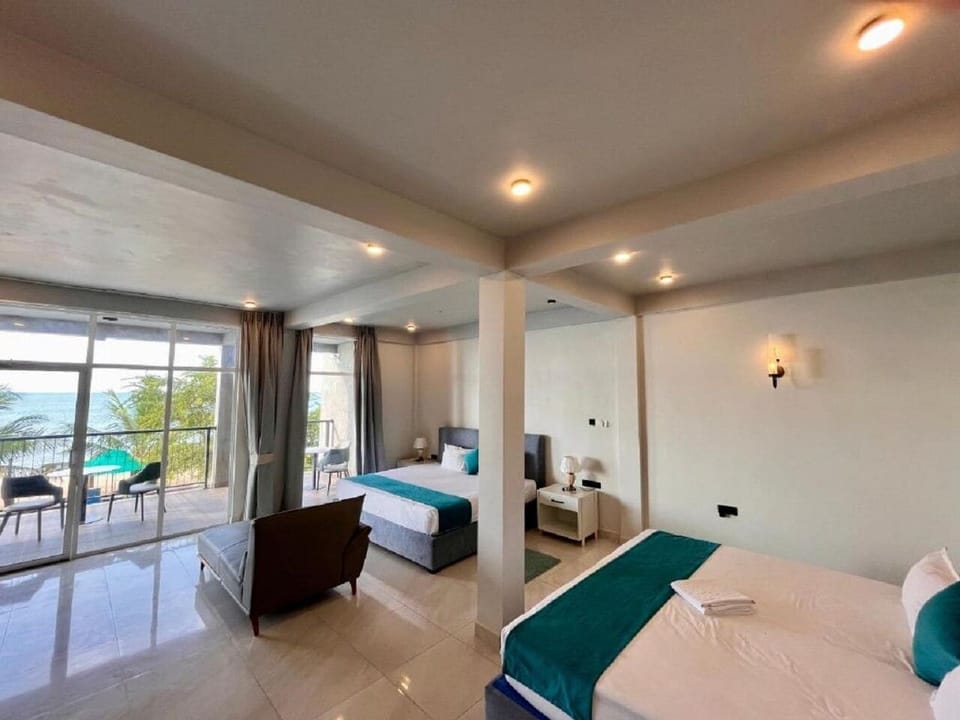 Deluxe Double Room, Balcony, Ocean View | In-room safe, laptop workspace, blackout drapes, iron/ironing board