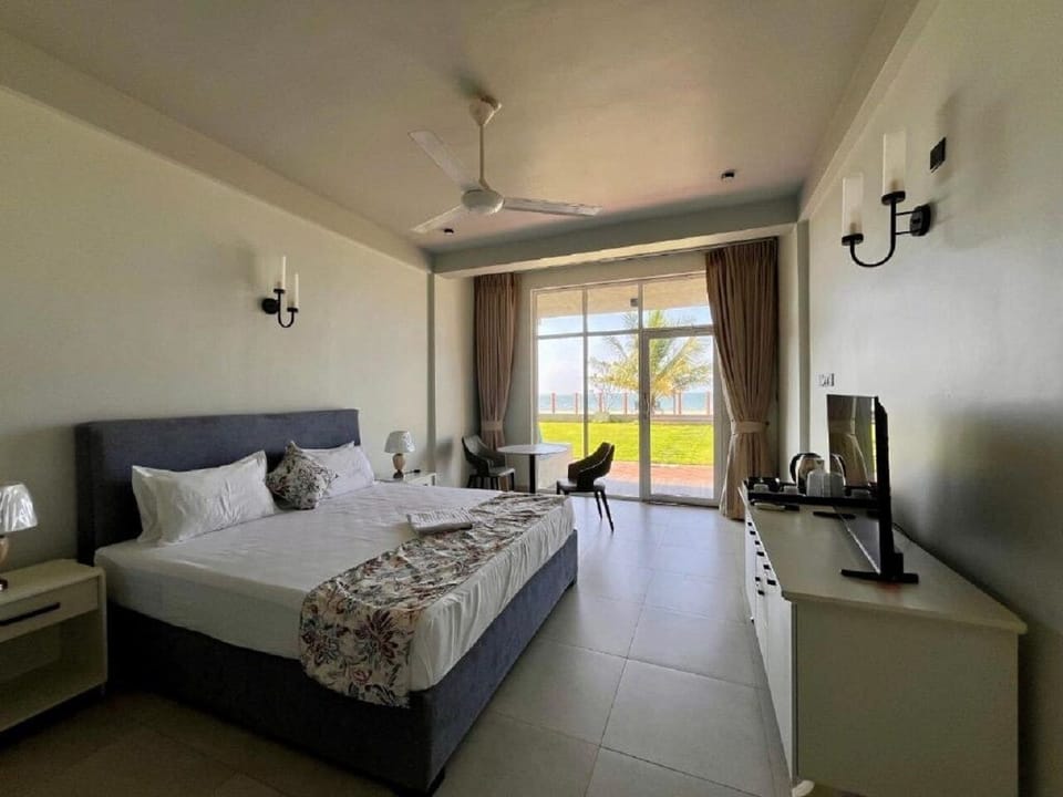 Deluxe Double Room, Balcony, Ocean View | In-room safe, laptop workspace, blackout drapes, iron/ironing board