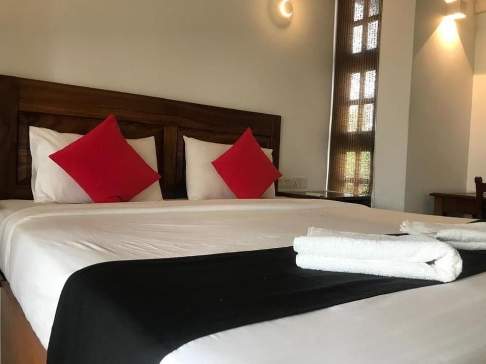 Deluxe Double Room, Balcony, Pool View | In-room safe, laptop workspace, iron/ironing board, free WiFi