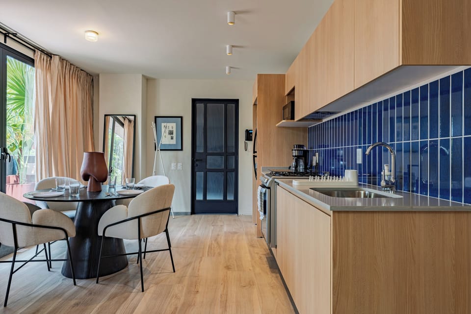 Presidential Condo, Courtyard View | Private kitchen | Full-size fridge, microwave, oven, stovetop