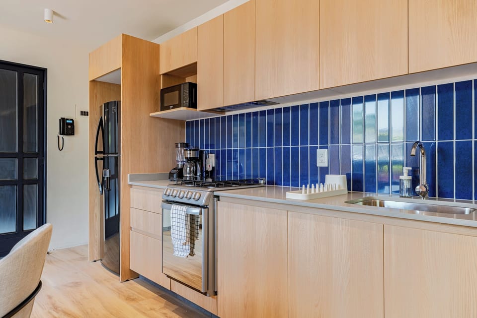 Presidential Condo, Courtyard View | Private kitchen | Full-size fridge, microwave, oven, stovetop