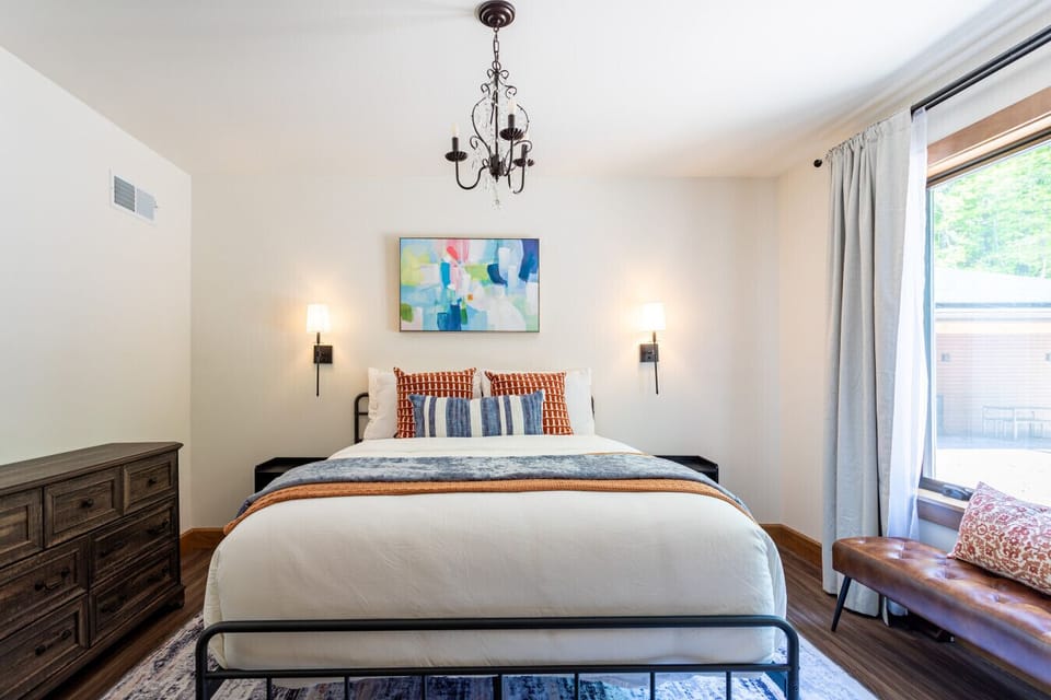 Unwind in this cozy bedroom with a comfortable queen bed and a calm, restful atmosphere