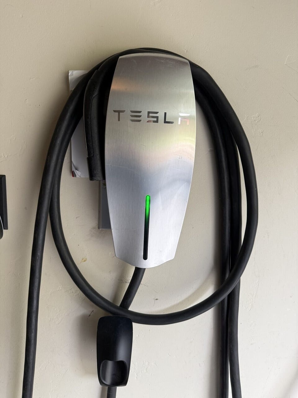 Tesla EV charger in the garage for you to use
