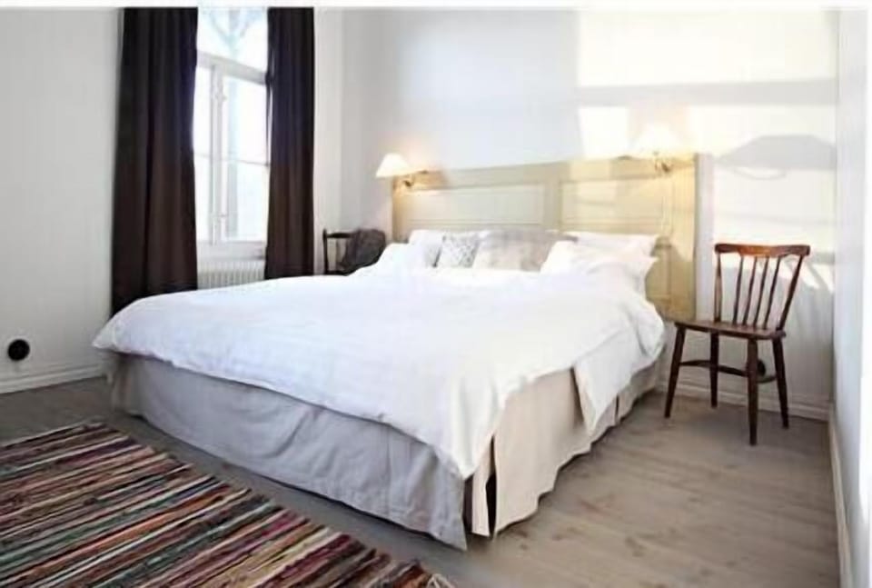 Standard Double Room | Desk, blackout drapes, iron/ironing board (on request), WiFi (free)