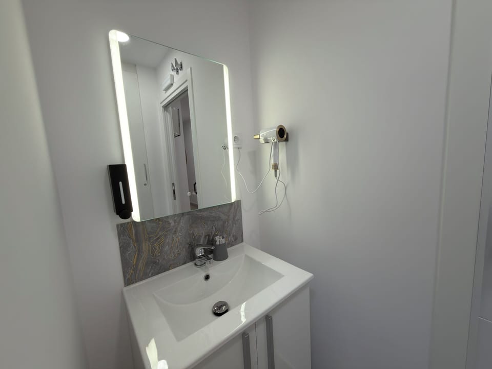 Comfort Double Room, Shared Bathroom | Bathroom | Hair dryer, towels, soap, shampoo