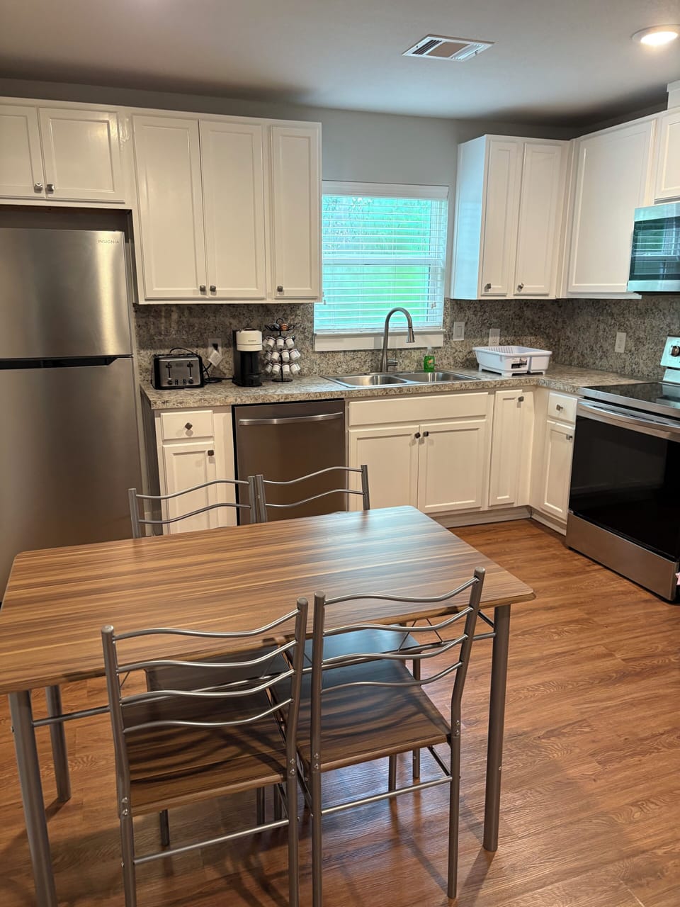 A 5 piece breakfast set adjacent to the kitchen 