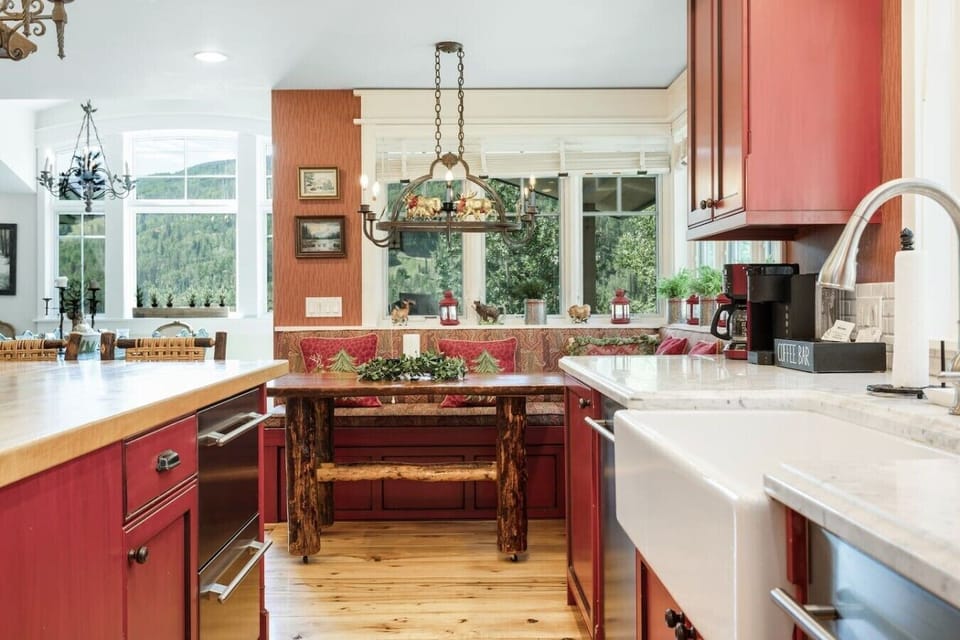 High end, fully equipped kitchen with breakfast nook and bar seating