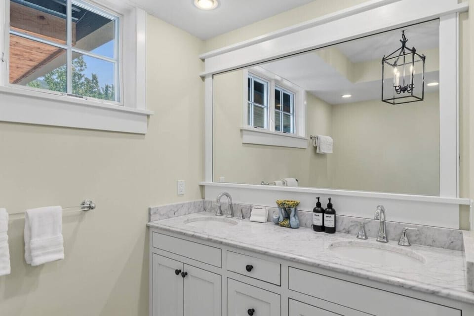 Primary Bathroom: En suite bathroom with walk-in shower and soaking tub