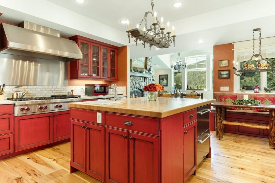 High end, fully equipped kitchen with breakfast nook and bar seating