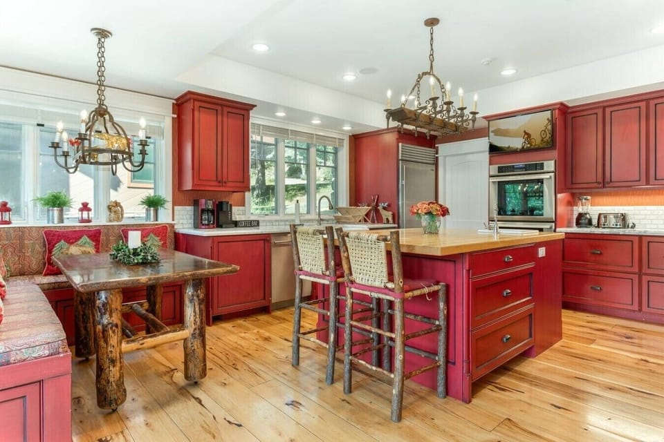 High end, fully equipped kitchen with breakfast nook and bar seating