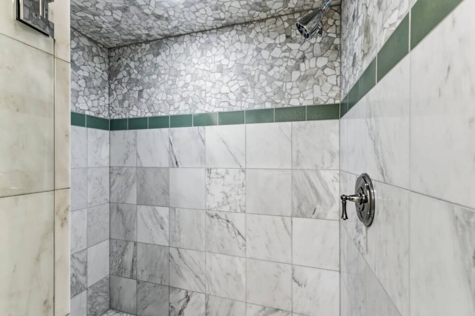 Primary Bathroom: En suite bathroom with walk-in shower and soaking tub