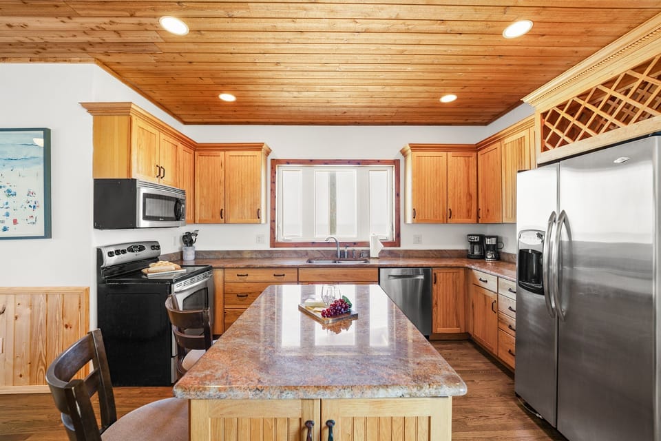 Spacious chef-style kitchen fully stocked for beach snacks, family dinners, and a perfect vacation getaway