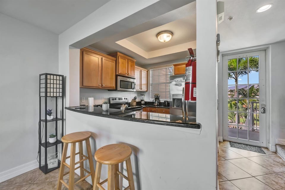 Full kitchen with prep and dining space