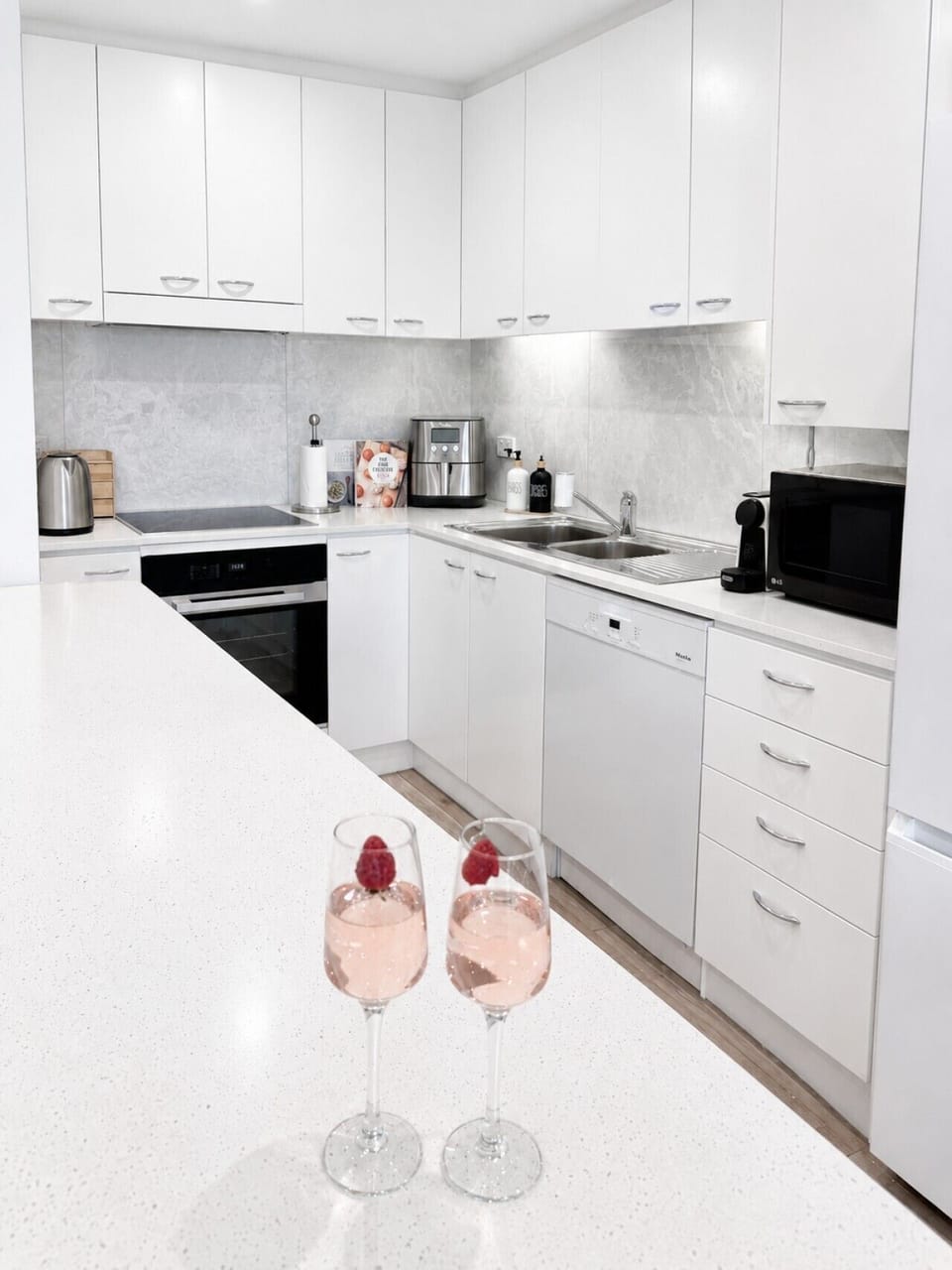 Fully equipped kitchen with stone benchtops, modern appliances and everything you need for a comfortable stay