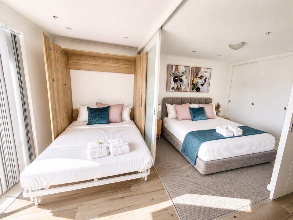 Perfect for couples, friends or families, this space offers a luxurious king bed plus a comfortable queen-size fold-down bed with a proper mattress, ensuring everyone enjoys a great night`s sleep