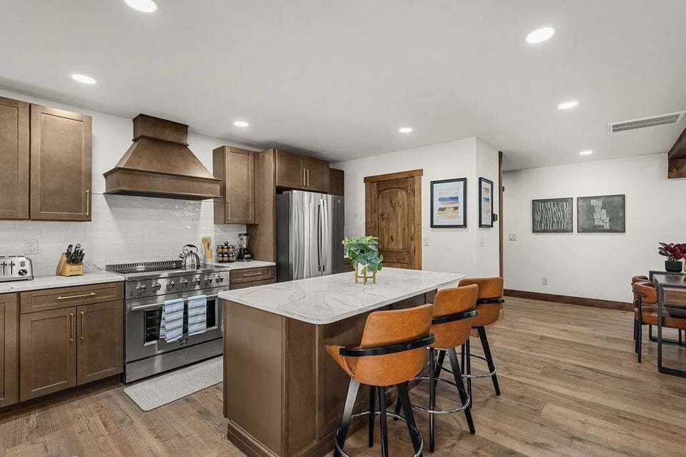 Stainless steel appliances, granite countertops, and enough cookware supplies for large meals!