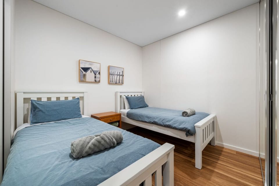 The fourth bedroom offers flexibility for families and singles with two twin beds.