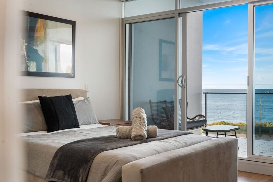 Enjoy sprawling ocean views directly from bed.