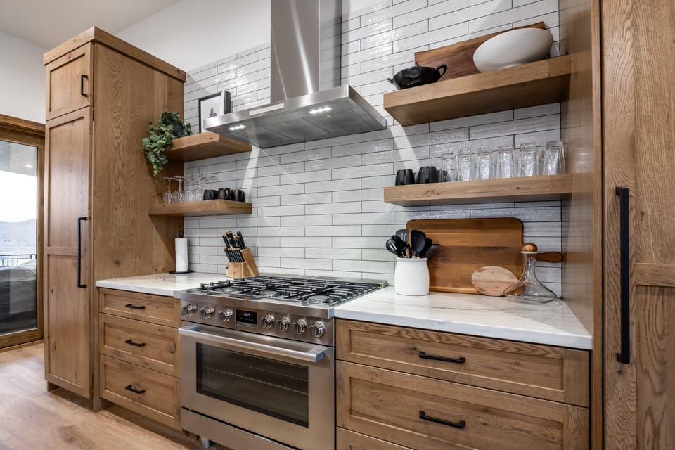 Chef's range · custom cabinetry · open shelving