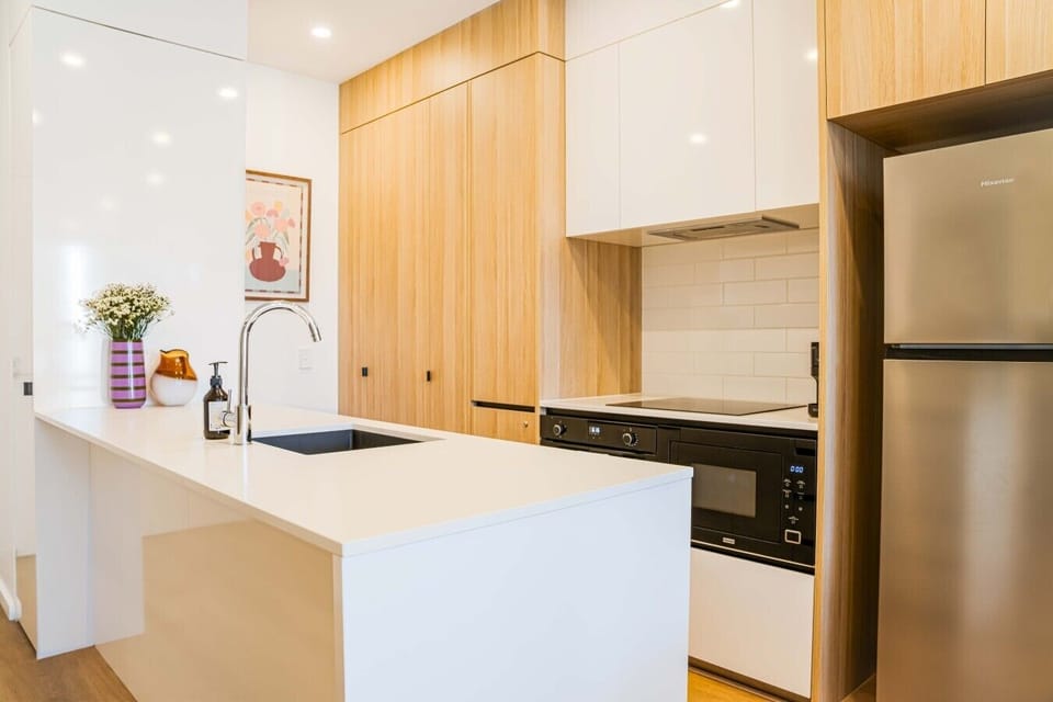 Cook up a feast in the fully equipped kitchen featuring modern appliances and ample bench space for your convenience.