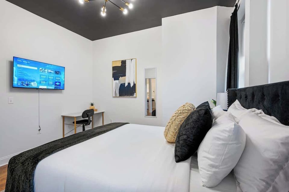 Beautifully decorated bedroom with room-darkening shades and curtains for a serene, restful environment. Enjoy a peaceful night’s sleep on our Nova Memory Foam Queen mattress, designed for ultimate comfort and support. Perfect for a rejuvenating stay
