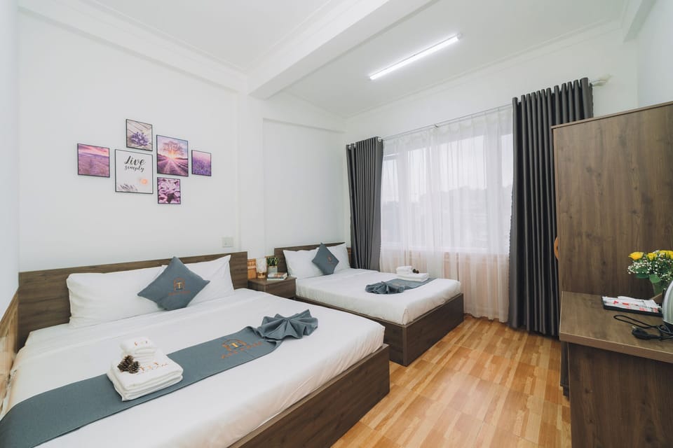 Deluxe Quadruple Room, City View | Iron/ironing board, free WiFi