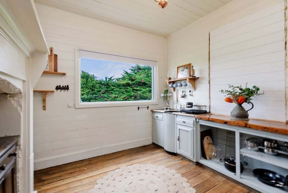 Bright kitchen with countryside views and modern essentials.