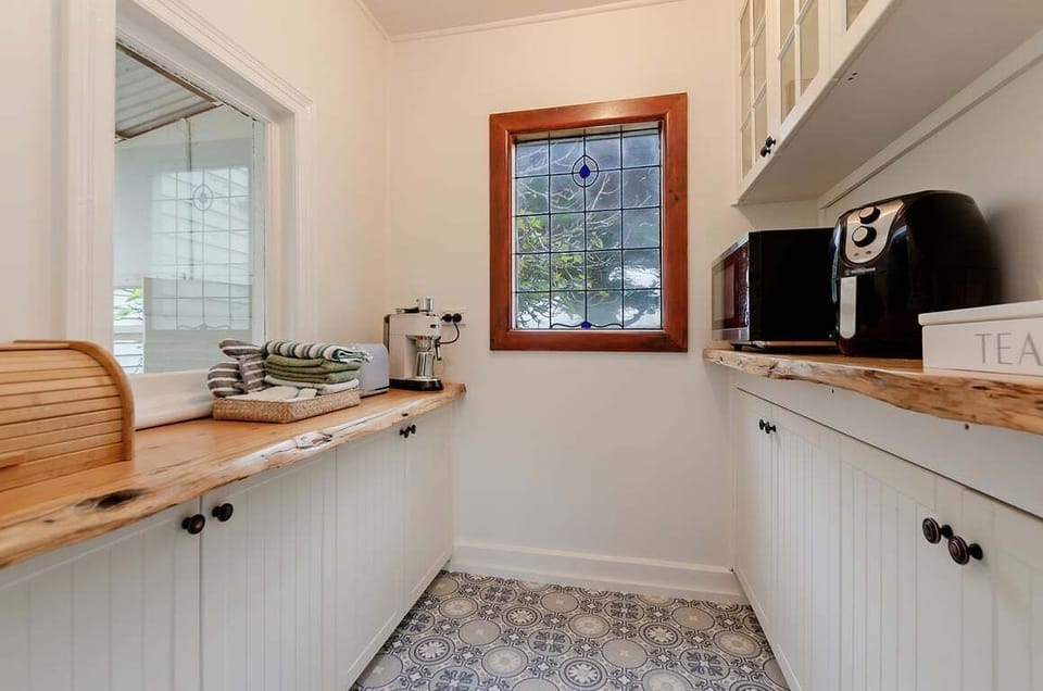 Kitchen with wooden counters and warm finishes.