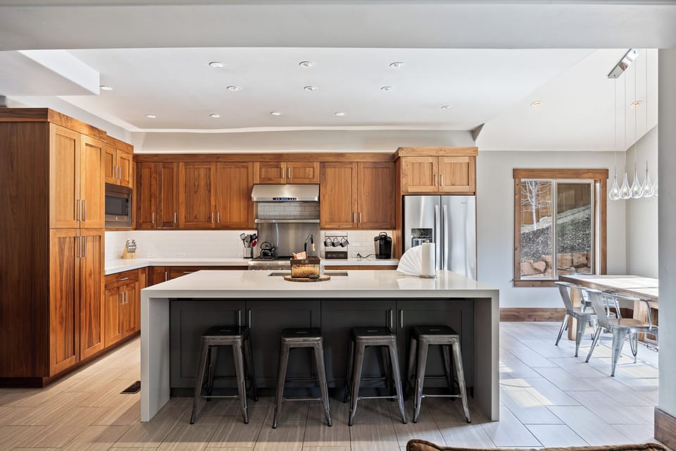 Large open kitchen with modern appliances, ample counter space, and seating at the island—perfect for cooking and entertaining.