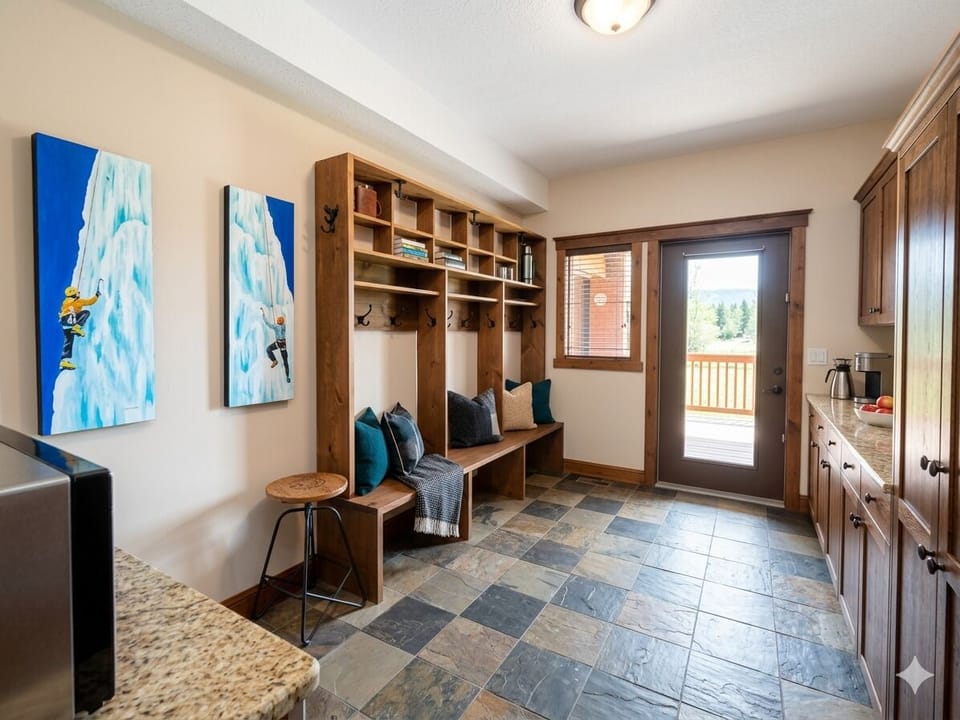 Dedicated storage and drying for your activity gear. Rear door leading to the lower-level private hot tub.