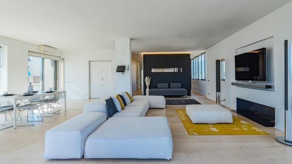 Apartment, Balcony, City View | Living area | Flat-screen TV