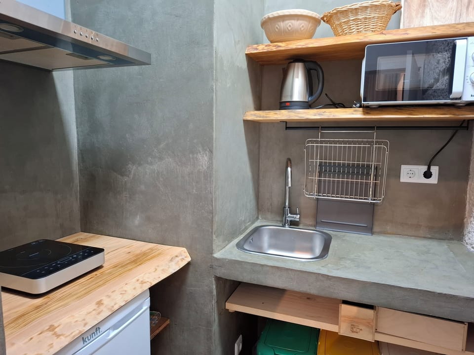 Family Studio, Garden View | Private kitchen | Microwave, electric kettle, highchair