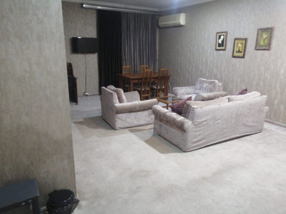 Deluxe Studio Suite, City View | Living area | 40-cm plasma TV with cable channels, printers