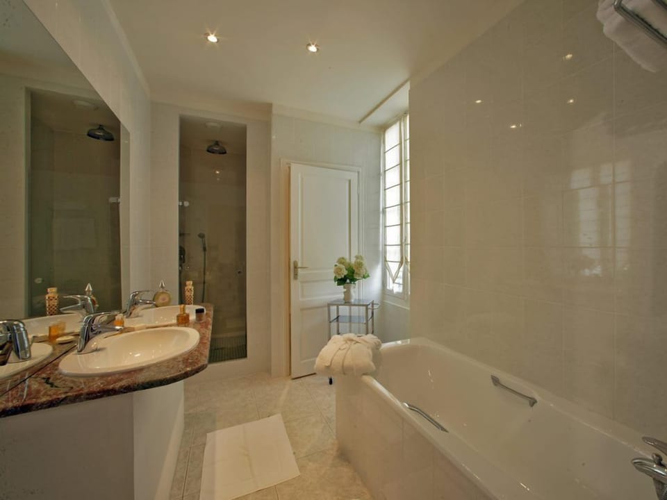 Comfort Suite (For 3) | Bathroom | Separate tub and shower, rainfall showerhead, hair dryer, slippers